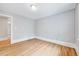 Empty bedroom featuring a light hardwood floor and neutral paint at 612 E Academy St, Fuquay Varina, NC 27526