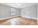 Bedroom featuring hardwood floors and neutral paint at 612 E Academy St, Fuquay Varina, NC 27526