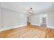 Well lit dining area featuring hardwood floors and an updated chandelier at 612 E Academy St, Fuquay Varina, NC 27526