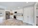Bright kitchen with stainless appliances, pantry, and white cabinets at 612 E Academy St, Fuquay Varina, NC 27526