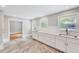 Bright kitchen featuring marble countertops and white cabinetry at 612 E Academy St, Fuquay Varina, NC 27526