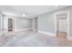 The large main bedroom offers soft carpet, neutral walls, and easy access to a large closet at 612 E Academy St, Fuquay Varina, NC 27526