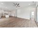 Spacious living room featuring wood floors, a ceiling fan, and access to the kitchen at 616 Gainer Dr # 15, Raleigh, NC 27610
