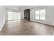 Bright and open living space with modern fireplace, large windows, and sliding glass doors at 616 Gainer Dr # 15, Raleigh, NC 27610