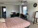 Bedroom with a bed, desks, whiteboard, and natural light, perfect for work or relaxation at 6332 Andante Ave, Raleigh, NC 27616