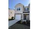 Charming two-story home with a modern design, stone accents, and a one-car garage at 6332 Andante Ave, Raleigh, NC 27616