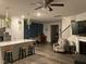 Open living room featuring stylish decor, a fireplace, and a ceiling fan at 6332 Andante Ave, Raleigh, NC 27616