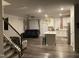 Open living area showcases a kitchen island and a comfortable living space at 6332 Andante Ave, Raleigh, NC 27616