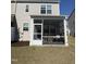 Enclosed patio features screen windows, a door, and provides a relaxing outdoor space at 6332 Andante Ave, Raleigh, NC 27616