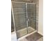 Modern tiled shower with glass doors and chrome fixtures, providing a luxurious bathing experience at 6332 Andante Ave, Raleigh, NC 27616