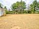 Level lot home with mature trees offers the perfect backyard retreat at 68 S Grace Way, Henderson, NC 27537