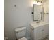 This bathroom features a new vanity, mirror, updated faucet, and light fixture at 68 S Grace Way, Henderson, NC 27537