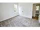 Well lit bedroom shows neutral walls, closet door and access to other room at 68 S Grace Way, Henderson, NC 27537