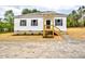 Charming single-story home with white siding, black shutters, and a cozy front porch at 68 S Grace Way, Henderson, NC 27537