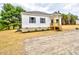 Charming home showcases a wood porch and manicured landscaping at 68 S Grace Way, Henderson, NC 27537