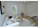 Comfortable living room featuring stylish furniture, contemporary decor, and sleek flooring at 68 S Grace Way, Henderson, NC 27537