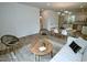 Open living space flowing into dining area, featuring modern decor and sleek flooring at 68 S Grace Way, Henderson, NC 27537