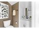Bathroom featuring a white vanity, chess-themed wall art, and contrasting hardware and wall colors at 687 Bandon Aly, Cary, NC 27513