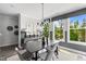 Stylish dining area featuring a black dining table, decorative lighting, and an expansive view at 687 Bandon Aly, Cary, NC 27513