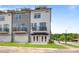 Modern townhome exterior with gray siding, balconies, and a welcoming entrance at 687 Bandon Aly, Cary, NC 27513
