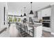 Bright kitchen with a large center island, modern appliances, and ample cabinet space for a chef-inspired cooking experience at 687 Bandon Aly, Cary, NC 27513