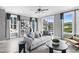 Modern living room with a comfortable sofa, stylish decor, and a balcony overlooking a scenic outdoor view at 687 Bandon Aly, Cary, NC 27513