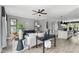 Open living room showcases a comfortable sofa, stylish accent chairs, and a view into a modern kitchen at 687 Bandon Aly, Cary, NC 27513