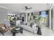 Cozy living room with modern furnishings and an open layout that flows seamlessly into a bright kitchen area at 687 Bandon Aly, Cary, NC 27513