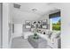 Living room with seating, carpet flooring, neutral decor, and a bright window view at 687 Bandon Aly, Cary, NC 27513