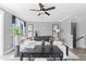 Comfortable living room with gray walls, stylish furnishings, and a ceiling fan at 687 Bandon Aly, Cary, NC 27513