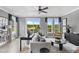 Inviting living room with a comfortable seating area, stylish decor, and a view of the outdoors through large windows at 687 Bandon Aly, Cary, NC 27513