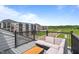 Scenic patio with seating area and views of a green landscape and apartment complex at 687 Bandon Aly, Cary, NC 27513