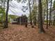 Relax in this wooded backyard with a porch and plenty of shade at 706 Mossburn Ct, Fuquay Varina, NC 27526