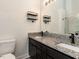 Bathroom features a double sink with granite countertops and a glass enclosed shower at 706 Mossburn Ct, Fuquay Varina, NC 27526