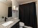 Updated bathroom features a black faucet, granite countertop, and stylish fixtures at 706 Mossburn Ct, Fuquay Varina, NC 27526