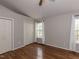 This primary bedroom is adorned with hardwood flooring, vaulted ceilings, and a ceiling fan at 706 Mossburn Ct, Fuquay Varina, NC 27526