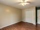 Spacious bedroom includes a ceiling fan, hardwood floors, and a closet at 706 Mossburn Ct, Fuquay Varina, NC 27526