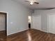 The main bedroom is spacious and features multiple closets, hardwood floors, and neutral paint at 706 Mossburn Ct, Fuquay Varina, NC 27526