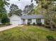 Charming single-story home with a well-maintained lawn and attached garage in a quiet neighborhood at 706 Mossburn Ct, Fuquay Varina, NC 27526