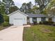 Charming single-story home with a well-maintained lawn and attached garage in a quiet neighborhood at 706 Mossburn Ct, Fuquay Varina, NC 27526
