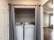 The laundry area offers side-by-side washer and dryer hookups enclosed by a curtain at 706 Mossburn Ct, Fuquay Varina, NC 27526