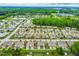 An aerial view showcases the neighborhood, surrounded by many trees and greenery at 72 E Moss Creek Dr, Clayton, NC 27520