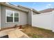 Private backyard, fenced, with a window looking into the home's interior at 72 E Moss Creek Dr, Clayton, NC 27520