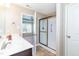 The bright bathroom offers a stand-up shower with glass doors and opens to a bedroom at 72 E Moss Creek Dr, Clayton, NC 27520