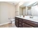This bathroom features a double sink vanity, toilet, and tiled flooring at 72 E Moss Creek Dr, Clayton, NC 27520