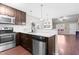 Modern kitchen features stainless steel appliances and a breakfast bar at 72 E Moss Creek Dr, Clayton, NC 27520