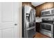 Modern kitchen features stainless steel appliances and white subway tile at 72 E Moss Creek Dr, Clayton, NC 27520