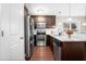 Kitchen boasts stainless steel appliances, granite countertops, and subway tile backsplash at 72 E Moss Creek Dr, Clayton, NC 27520