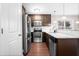 Kitchen boasts stainless steel appliances, granite countertops, and subway tile backsplash at 72 E Moss Creek Dr, Clayton, NC 27520