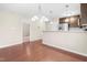 Open kitchen features stainless steel appliances, granite countertops, and hardwood floors at 72 E Moss Creek Dr, Clayton, NC 27520
